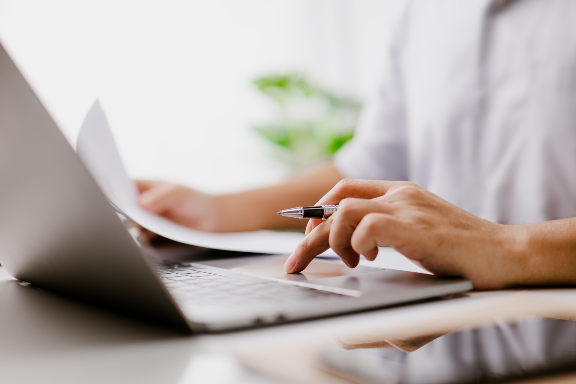 Businessman typing on a laptop